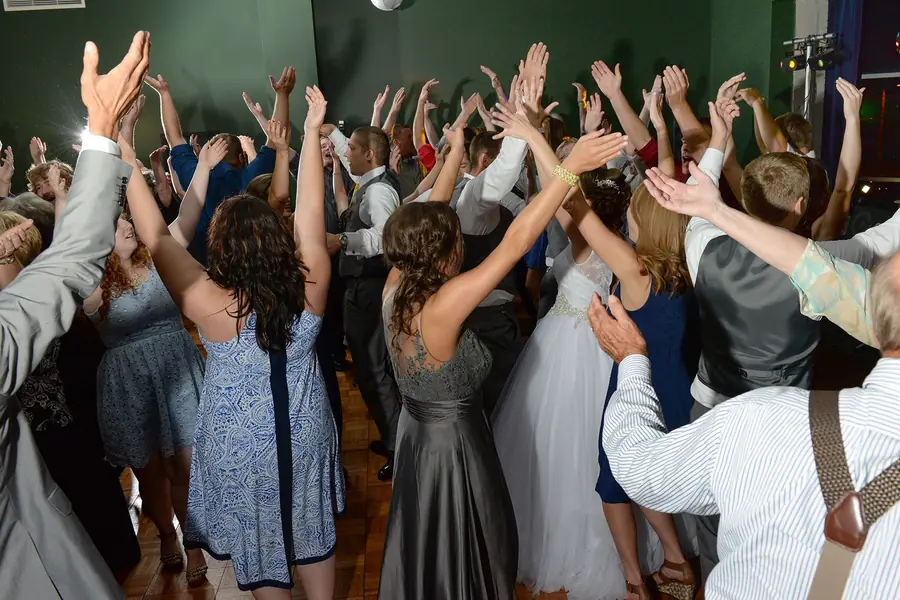 Packed dance floor with colored lighting